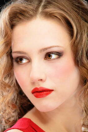 Charming lady in red evening dress