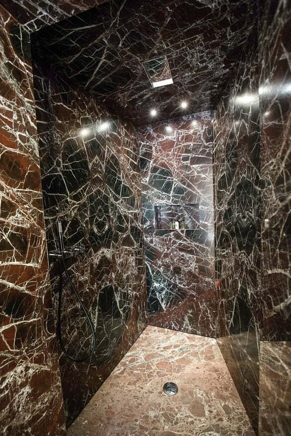 A marble shower stands inside a bathroom of a suite of Fendi Private Suites inside Palazzo Fendi.