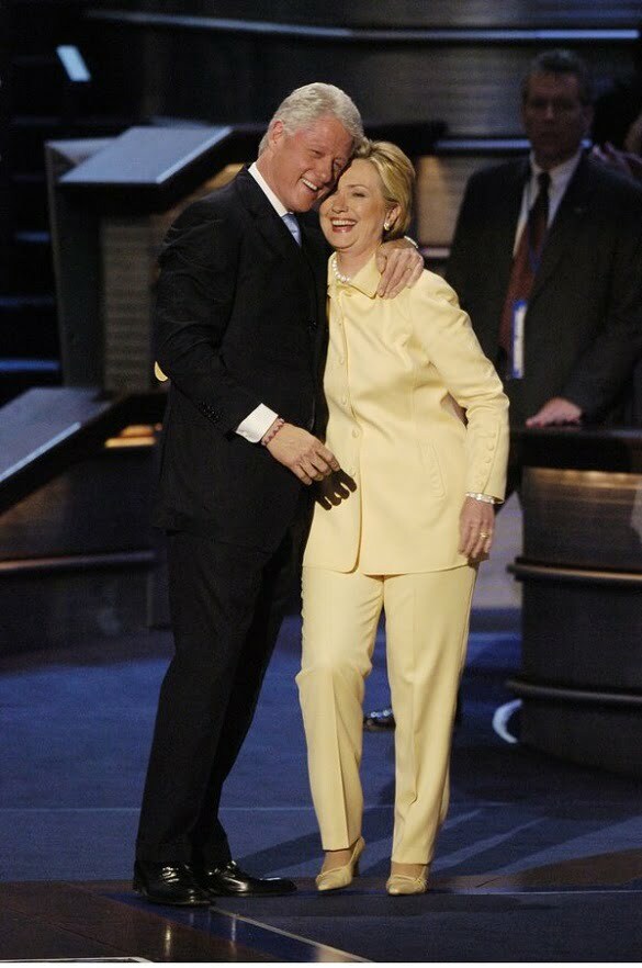 Former President Bill Clinton hugs his wife, Sen. Hillary Cl