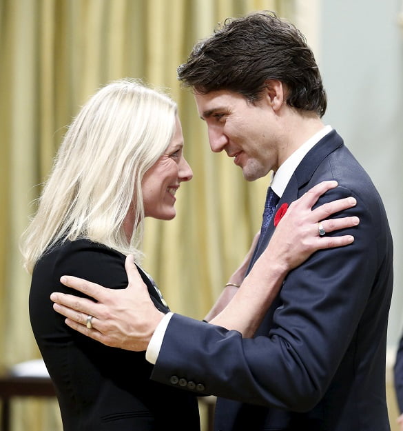 Canada's new Environment and Climate Change Minister Catherine McKenna (L) is congratulated by Prime Minister Justin Trudeau at Rideau Hall in Ottawa, November 4, 2015. Liberal leader Justin Trudeau, 43, kicked off his majority government with some controversy with his decision to name an equal number of men and women to a slimmed-down Cabinet, the first time gender parity has been achieved in Canada's team of ministers. REUTERS/Chris Wattie