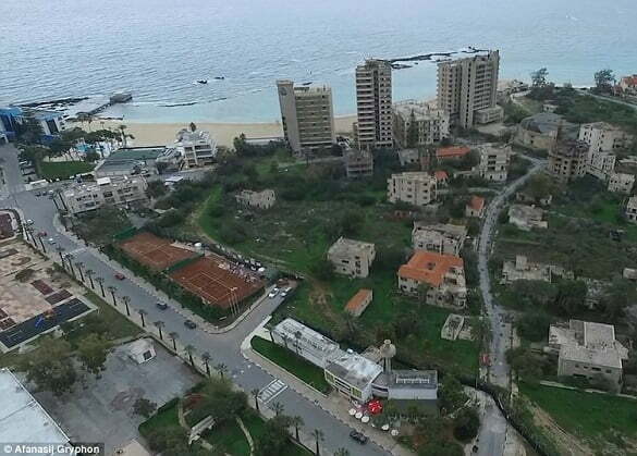 High-rise hotels are crumbling and the land has been reclaimed by overgrown vegetation in Varosha, a suburb of Famagusta, Cyprus